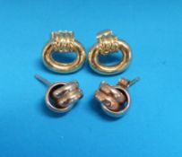 A pair of 9ct gold earrings in the form of a knot and a pair of 18ct gold earrings
