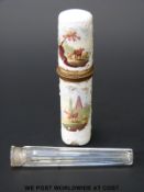 An 18thC French enamel cylindrical perfume bottle case and glass bottle within decorated with