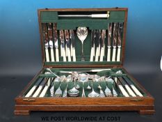 An oak cased canteen of cutlery