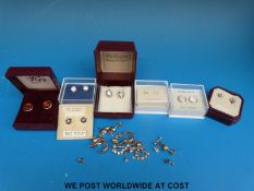 A pair of 9ct gold earrings set with diamonds and pink quartz,