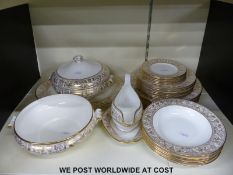 A Wedgwood six place dinner service in Gold Florentine pattern