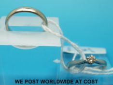 A 9ct white gold wedding band together with a platinum ring set with a solitaire diamond (size J/K)