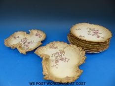 A collection of Limoges dessert plates
