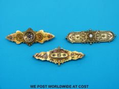 Three 15ct gold brooches set with diamonds and one with a ruby (9.