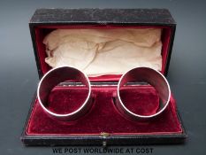 A pair of cased hallmarked silver napkin rings,