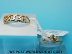 A 9ct gold ring set with a diamond in a twist design and a 9ct gold ring