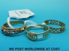 Three 9ct gold rings one in a Celtic design, one foliate design and one floral design (6.