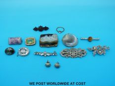 A quantity of brooches to include agate set, paste and garnet,