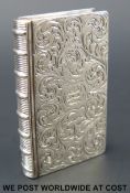 A Victorian hallmarked silver novelty vinagrette formed as a book with engraved decoration,