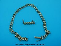 A 9c gold bracelet made up of smooth links together with a matching brooch (16.