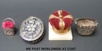 Three 19thC white metal pin cushions and a gilt crown example,