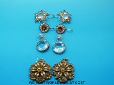 A pair of Victorian earrings set with garnets and seed pearls, two further pairs,