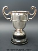 A hallmarked silver twin handled trophy cup,