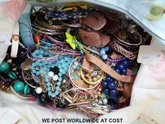 A large collection of costume jewellery in a Cath Kidston bag