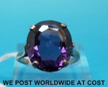 A silver ring set with a large oval amethyst (size O)