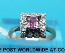 A 9ct gold ring set with a square cut pink quartz surrounded by diamonds (size L)