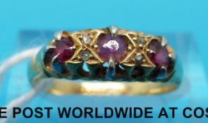 An 18ct gold ring set with diamonds and rubies (size N)