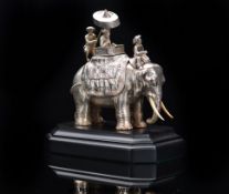A Victorian hallmarked silver novelty inkwell formed as an elephant transporting a gentleman with