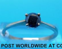 A 9ct gold ring set with round brilliant black diamond (size Q/R)