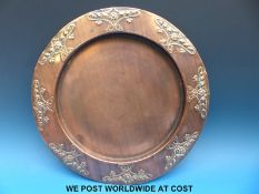 A copper platter with Art Nouveau design to edge, marked J S & S B to underside (31.