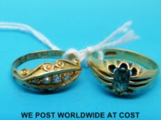 An 18ct gold ring set with diamonds and a yellow metal ring marked 18ct gold set with a green stone