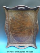 A carved hardwood two handled tray,