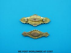 Two Victorian brooches marked 9ct gold set with diamonds with photo compartments to the back (4.