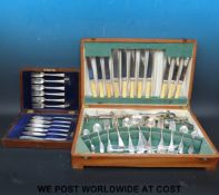 A cutlery canteen and contents together with a cased set of fish eaters