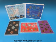 Three brilliant uncirculated UK coin sets together with a European community coin collection