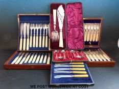 A quantity of cased silver plated cutlery to include hallmarked silver ferruled items