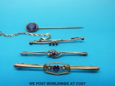 Three yellow metal bar brooches marked 9ct set with amethysts and seed pearls and a stick pin set