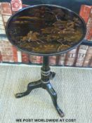A lacquered ebonised chonoiserie side table with tripod base and a large carved treen bowl table