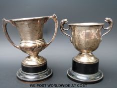 Two hallmarked silver twin-handled trophy cups,