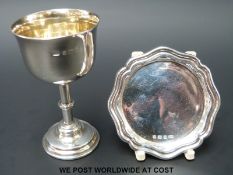 A George V hallmarked silver travelling communion cup and platter, the cup with gilt wash interior,