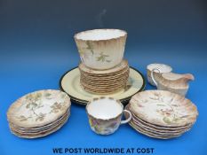 A collection of Doulton Burslem tea ware circa 1900 and two Royal Doulton plates decorated with