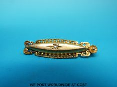 A 15ct gold brooch set with a diamond