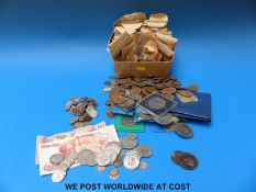 A collection of UK and world coinage, modern crowns,