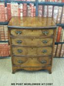 A small walnut bow fronted chest of four graduated drawers (H77 x W61 x D45cm)