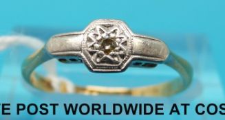 An Art Deco ring marked 18ct set with a diamond in a platinum setting (size M)