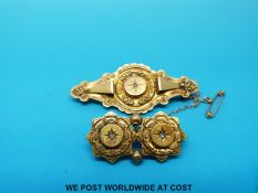 Two yellow metal gold brooches one set with diamonds the other with seed pearls marked 15ct