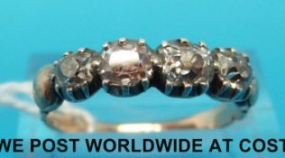 A late Georgian/ early Victorian ring set with four old cut diamonds (size P)