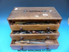 A toolmaker's chest containing jeweller's tools including dapping block,