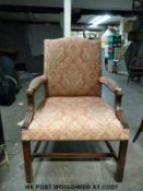 An upholstered armchair,