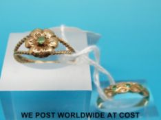 A 9ct gold ring set with an emerald in a flower setting and a 9ct gold ring set with alternating
