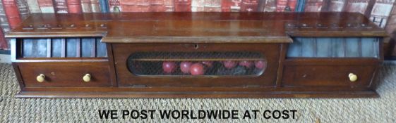 A vintage wall-mounted snooker or billiards cabinet fitted with three fall front flaps,