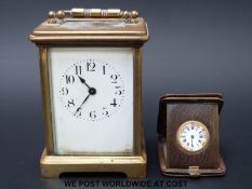 A small Gebruder Rodeck Wien travelling clock with Arabic numerals and a brass cased carriage clock