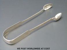 A pair of Georgian hallmarked silver sugar tongs Exeter 1821 maker William Hope, length 14.