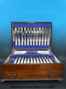 An oak cased twelve place canteen of cutlery,