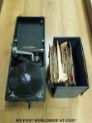 A wind up gramophone with a quantity of 78 rpm records