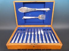 An oak cased twelve place setting fish service with servers